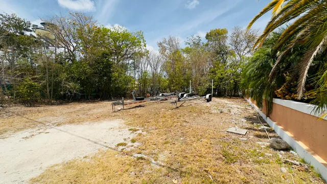 a view of swimming pool with a yard
