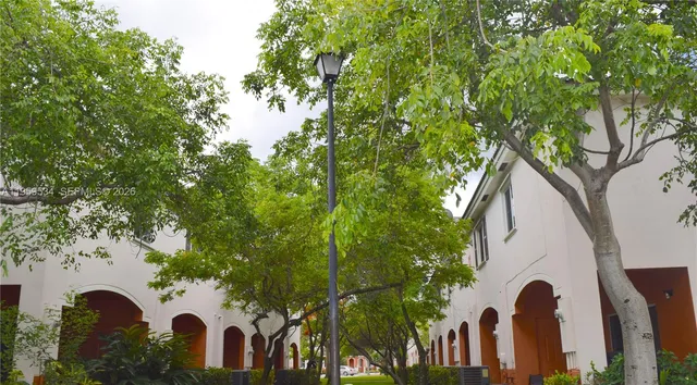 a view of a house with a tree