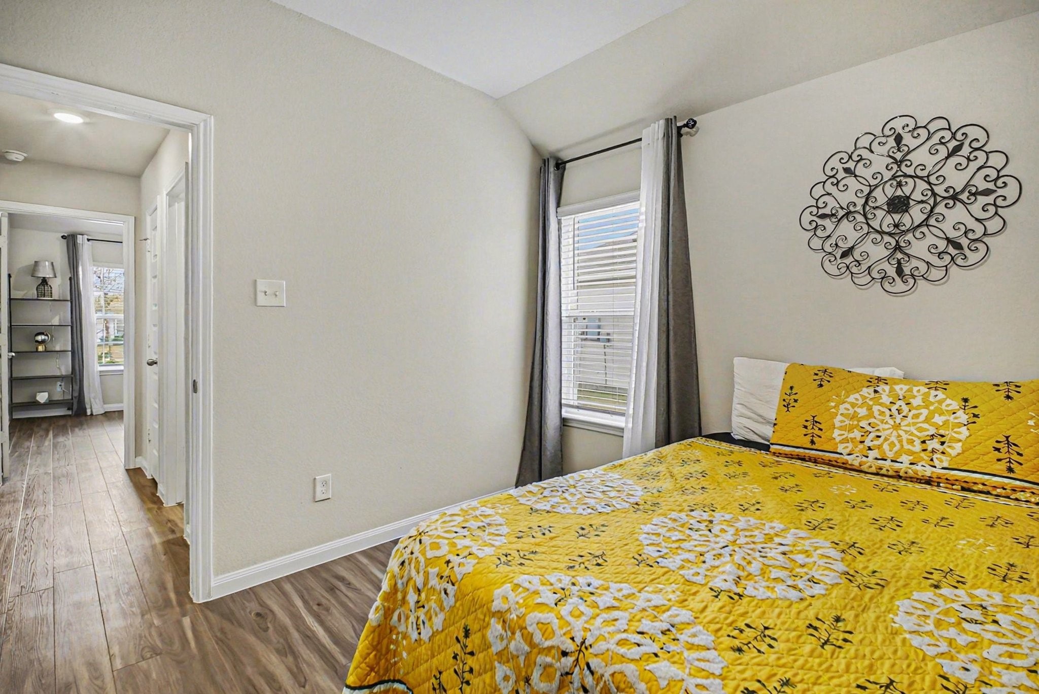 4906 Luke Matthew Drive Rosharon, TX 77583 - Photo 20 of 34 This cozy second bedroom features wood flooring, a window for ample natural light, creating a warm and inviting atmosphere