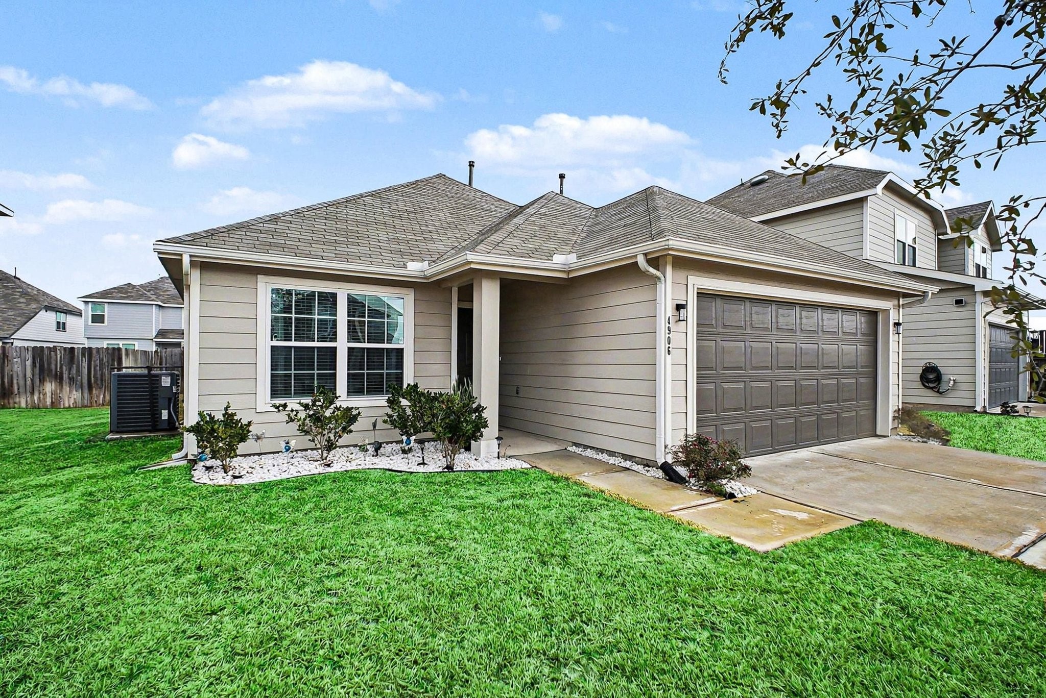 4906 Luke Matthew Drive Rosharon, TX 77583 - Photo 2 of 34 This recently completed single-story home features a modern exterior with a well-maintained lawn, a two-car garage, and a cozy front entryway. Ideal for those seeking a comfortable and stylish living space.
