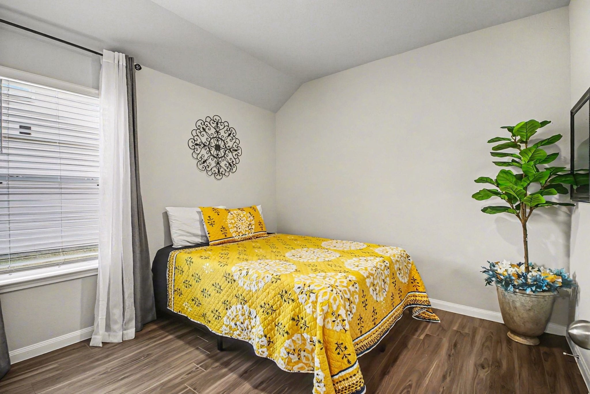 4906 Luke Matthew Drive Rosharon, TX 77583 - Photo 21 of 34 This cozy second bedroom features wood flooring, a window for ample natural light, creating a warm and inviting atmosphere