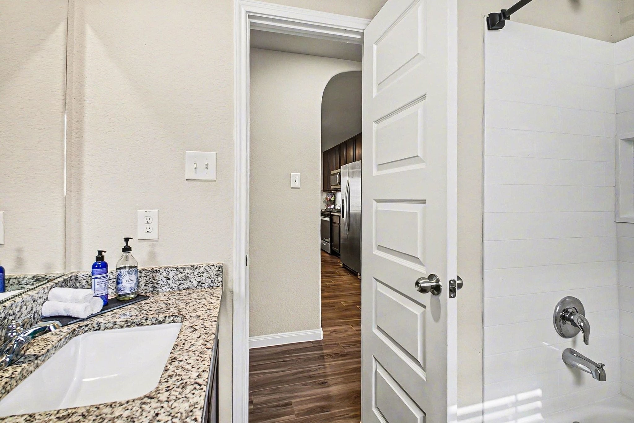 4906 Luke Matthew Drive Rosharon, TX 77583 - Photo 23 of 34 Modern second bathroom with granite countertops, a single sink, and a bathtub.