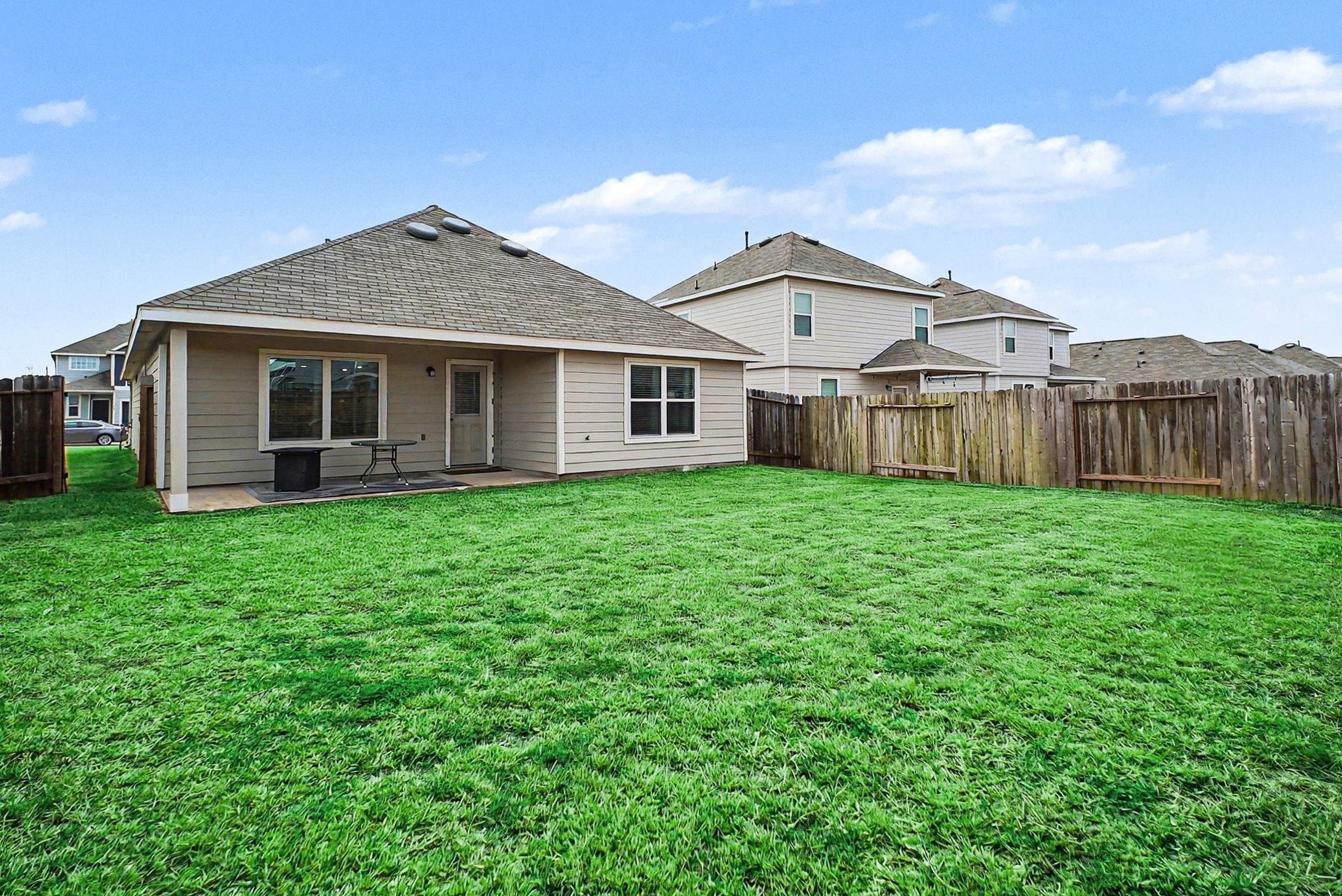 4906 Luke Matthew Drive Rosharon, TX 77583 - Photo 25 of 34 This single-story homehas a spacious fenced backyard, featuring a covered patio, perfect for outdoor relaxation and entertaining.