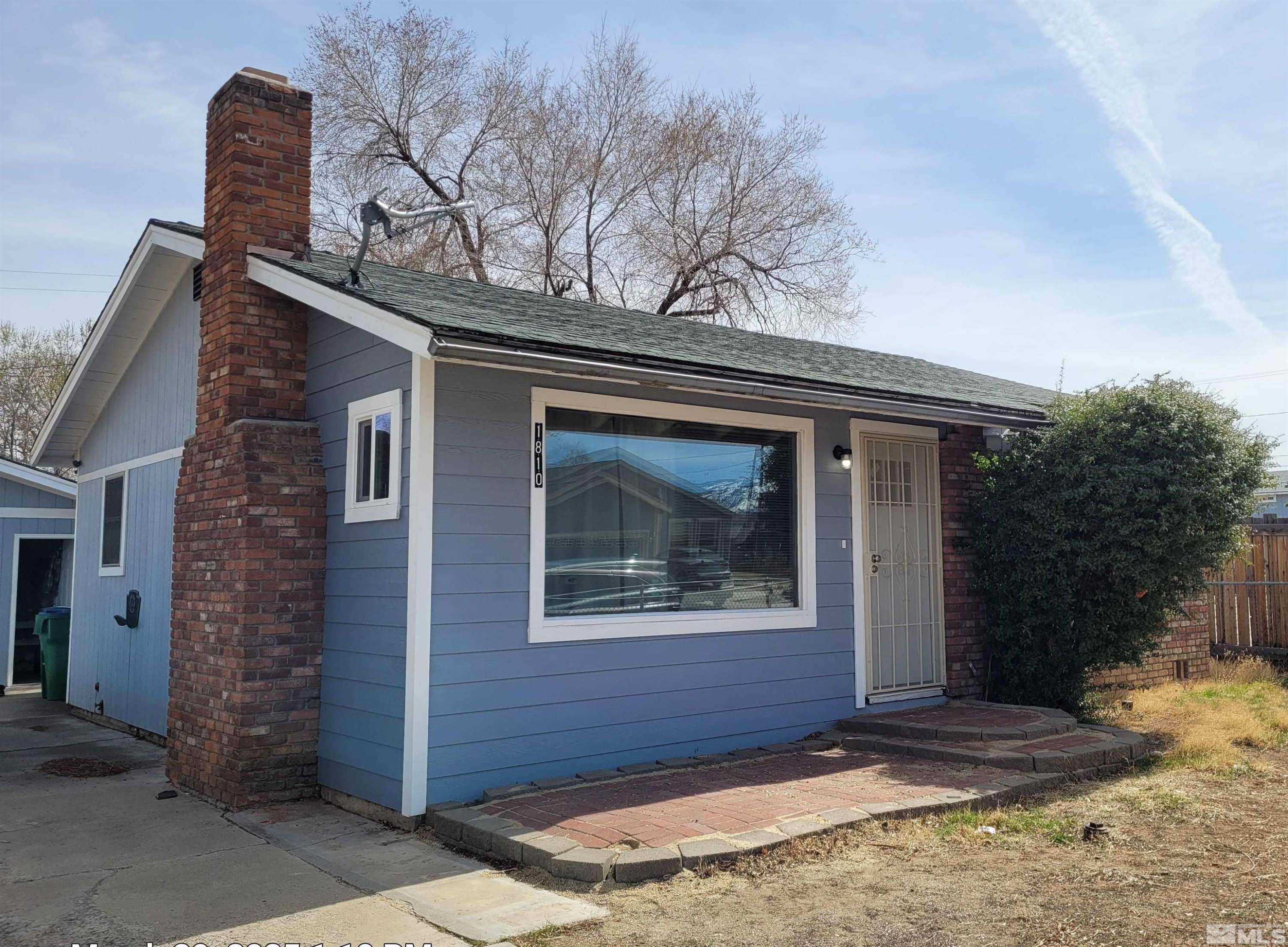 1810 Montello Street Reno, NV 89512 - Photo 1 of 22 a front view of a house