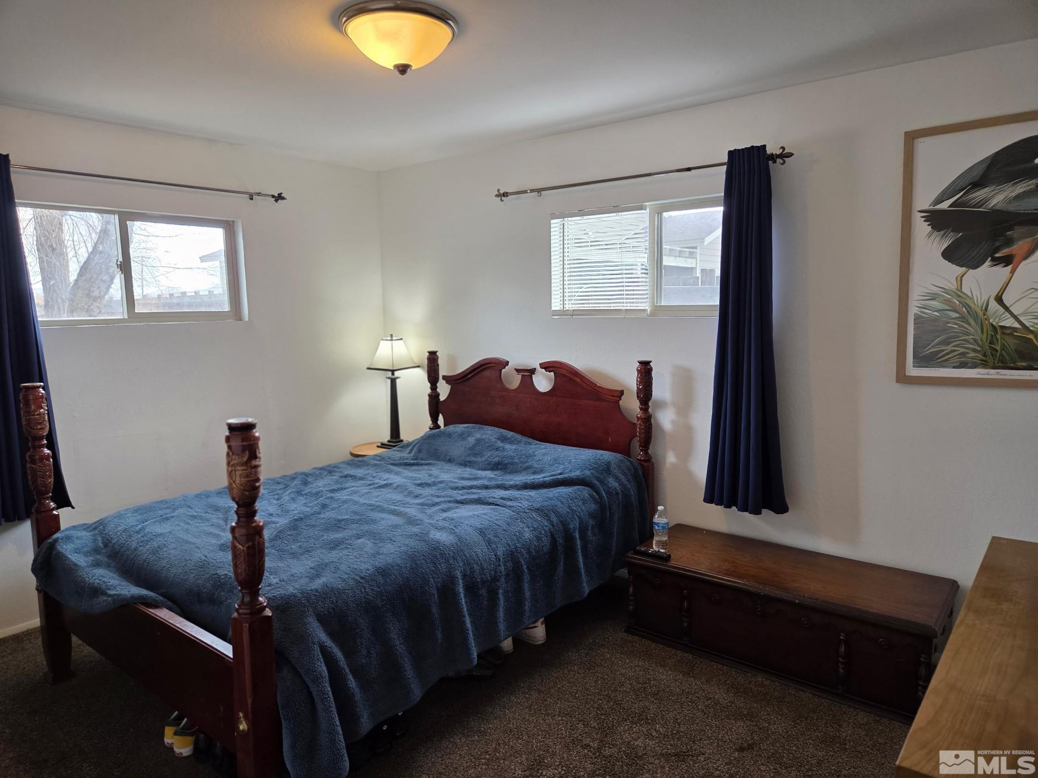 1810 Montello Street Reno, NV 89512 - Photo 11 of 22 a bedroom with a bed and a lamp next to a window
