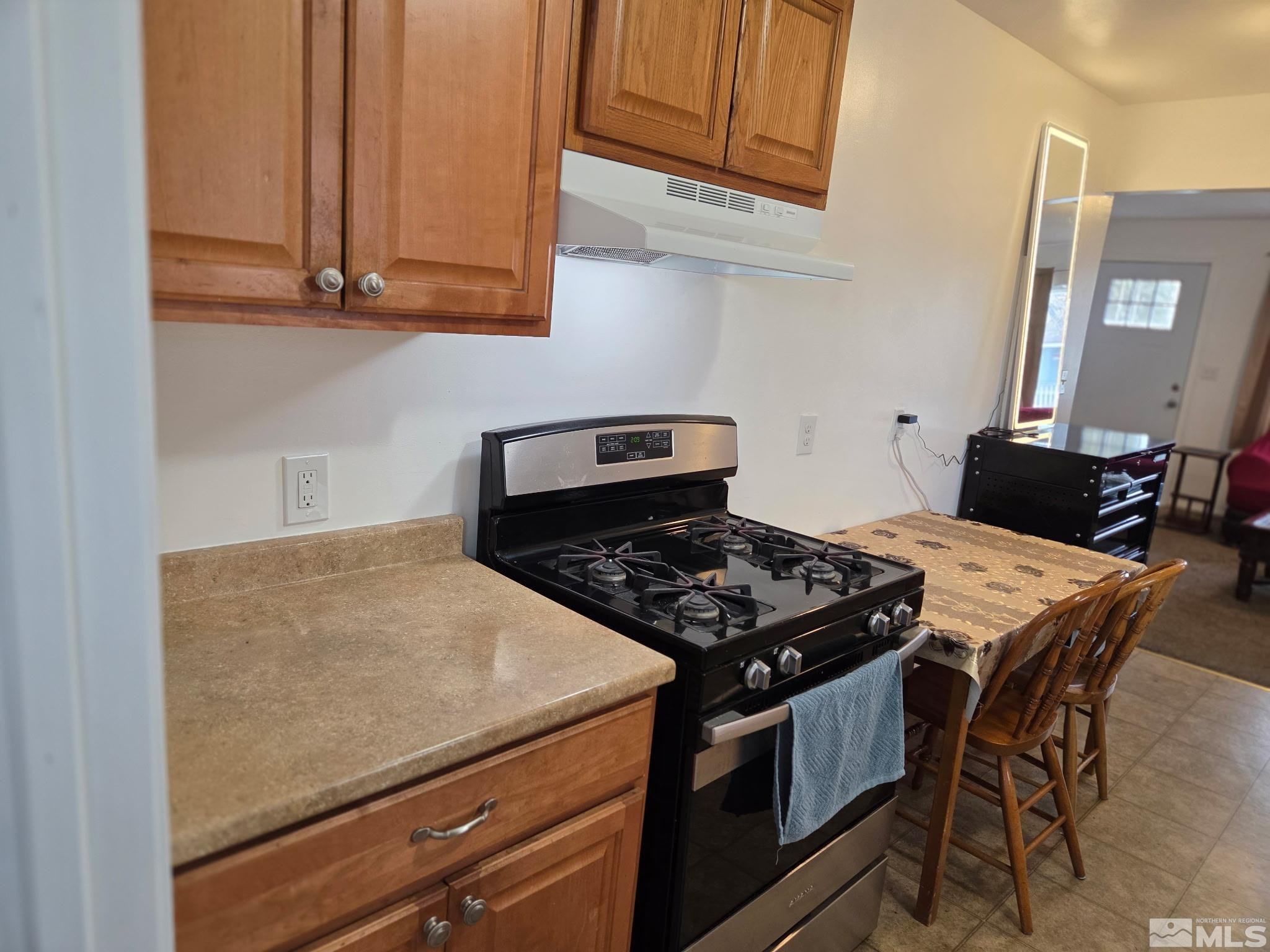1810 Montello Street Reno, NV 89512 - Photo 8 of 22 a stove top oven sitting inside of a kitchen