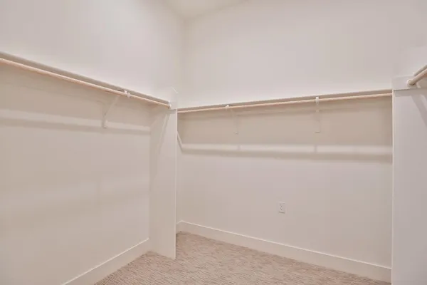 a view of an empty walk in closet