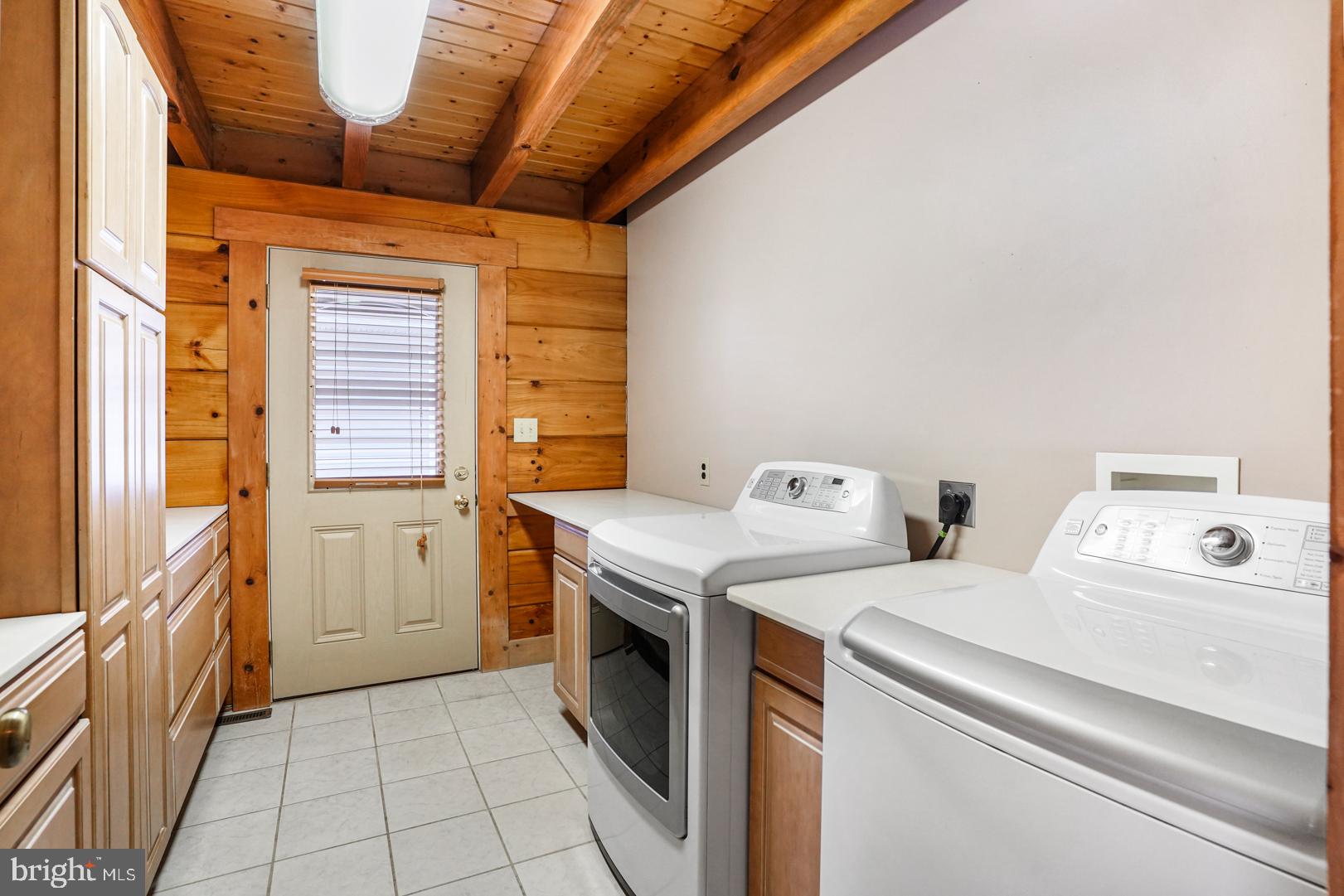 381 Dogtown Road Townsend, DE 19734 - Photo 36 of 71 Laundry room with a full wall of cabinetry