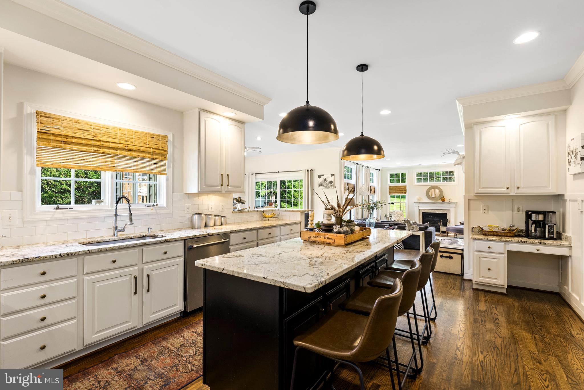 7 Redtree Lane Reisterstown, MD 21136 - Photo 16 of 56 a kitchen with a stove a sink a dining table and chairs