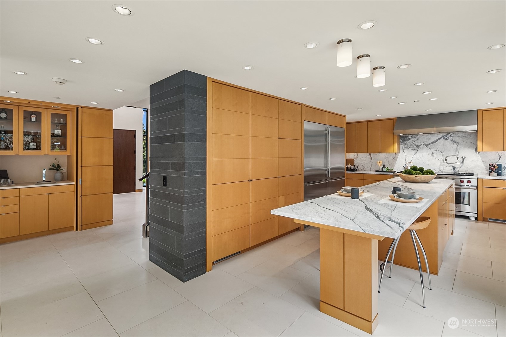 1829 Evergreen Point Road Medina, WA 98039 - Photo 11 of 39 a kitchen with stainless steel appliances kitchen island granite countertop a refrigerator and a stove top oven