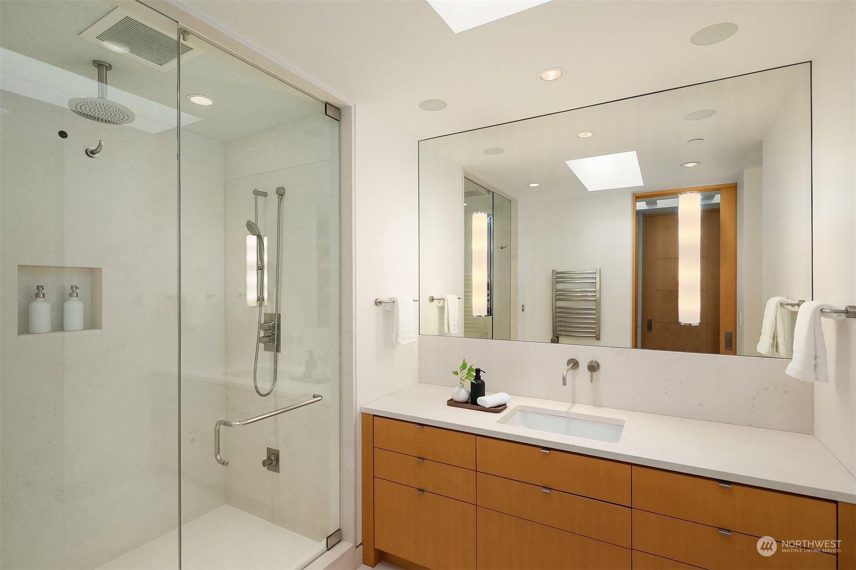 1829 Evergreen Point Road Medina, WA 98039 - Photo 26 of 39 a bathroom with a double vanity sink mirror and shower