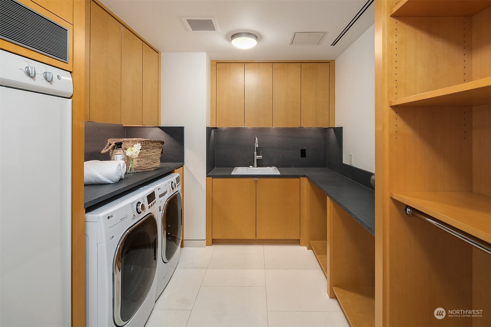 1829 Evergreen Point Road Medina, WA 98039 - Photo 31 of 39 a bathroom with a sink a washer and dryer