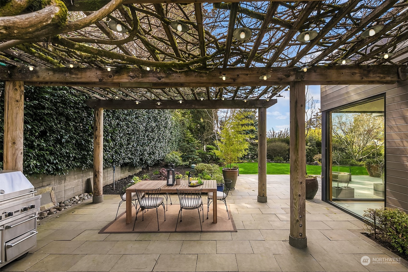 1829 Evergreen Point Road Medina, WA 98039 - Photo 36 of 39 a patio with yard glass top table and chairs