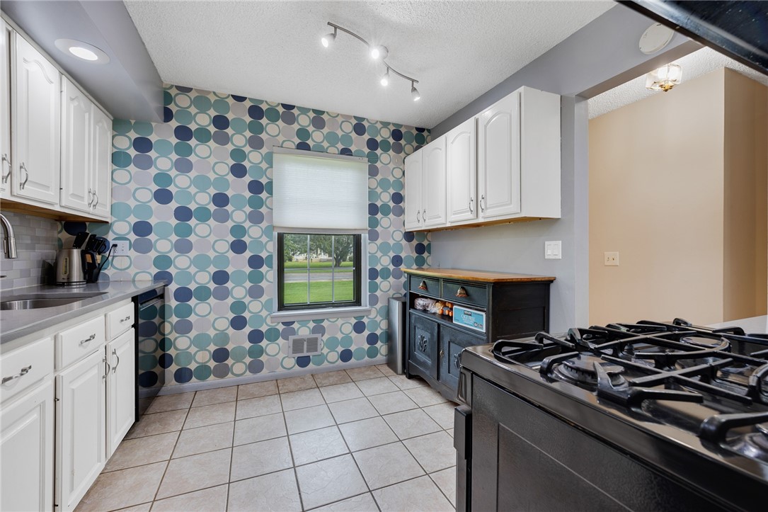 597 French Road Brighton, NY 14618 - Photo 5 of 24 View of kitchen looking toward front of home.