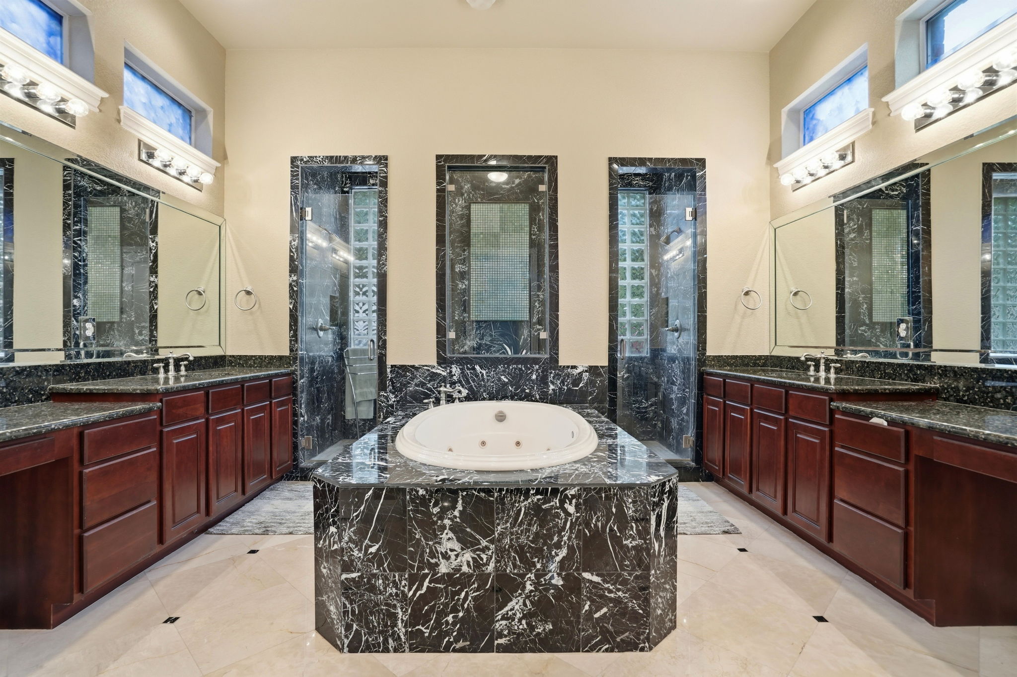 222 Vailco Lane Austin, TX 78738 - Photo 32 of 39 Luxurious bathroom featuring a marble-clad jetted tub