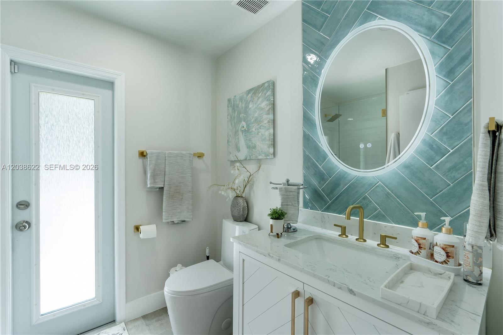 14830 Southwest 149th Street Miami, FL 33196 - Photo 11 of 43 a bathroom with a granite countertop toilet a sink and a mirror