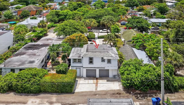 a view of a house with a garden and plants
