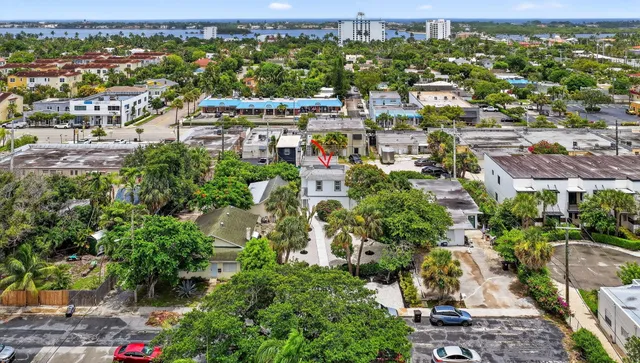 an aerial view of residential houses with outdoor space