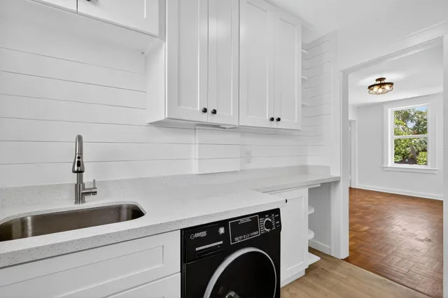 a view of storage and utility room with washer and dryer
