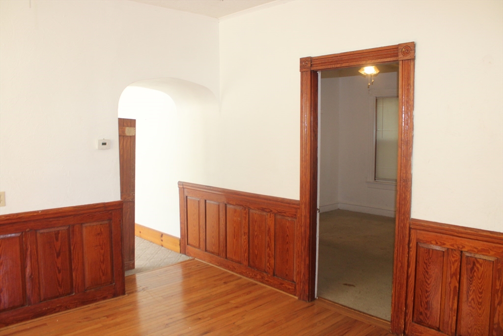 136 Horton Street, Unit 1 Fall River, MA 02723 - Photo 3 of 17 a view of hallway with wooden floor