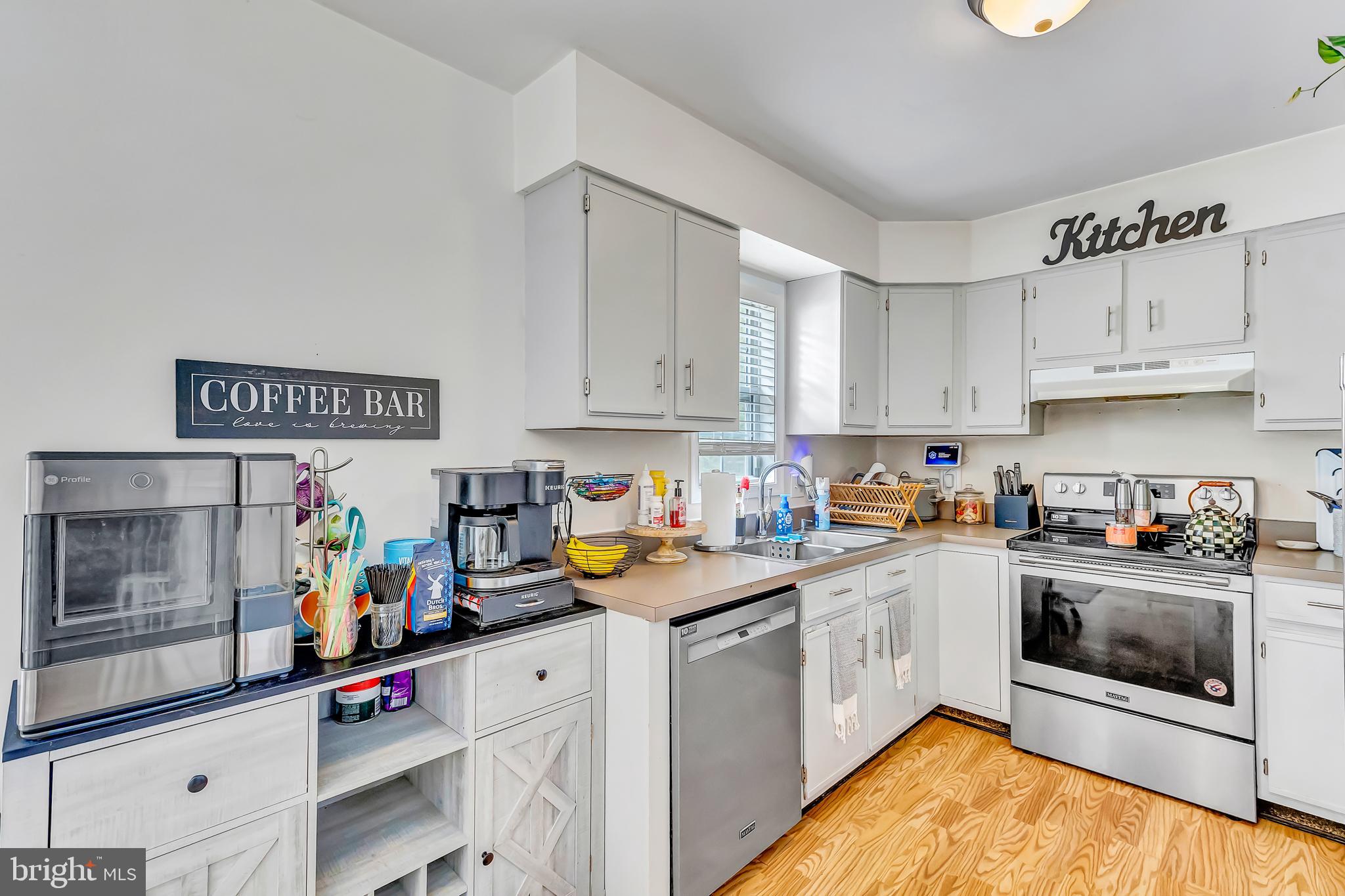 4925 Campground Road Eden, MD 21822 - Photo 7 of 42 a kitchen with stainless steel appliances granite countertop a lot of cabinets and wooden floor