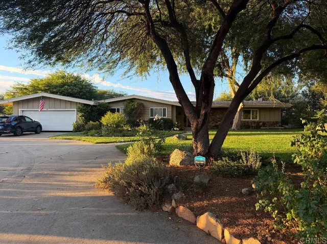 a front view of a house with swimming pool