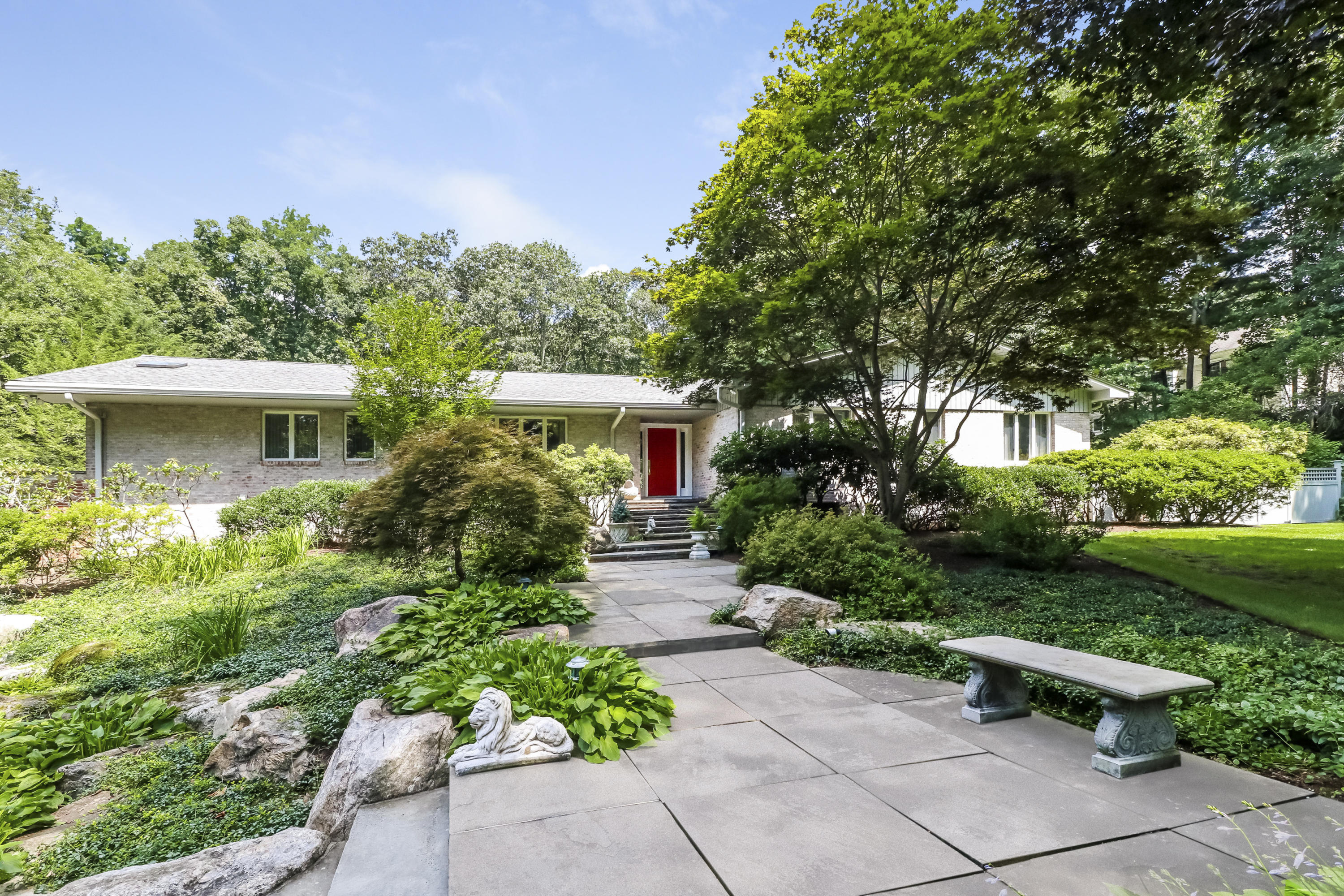 42 Quarry Road Stamford, CT 06903 - Photo 1 of 1 a front view of a house with a yard