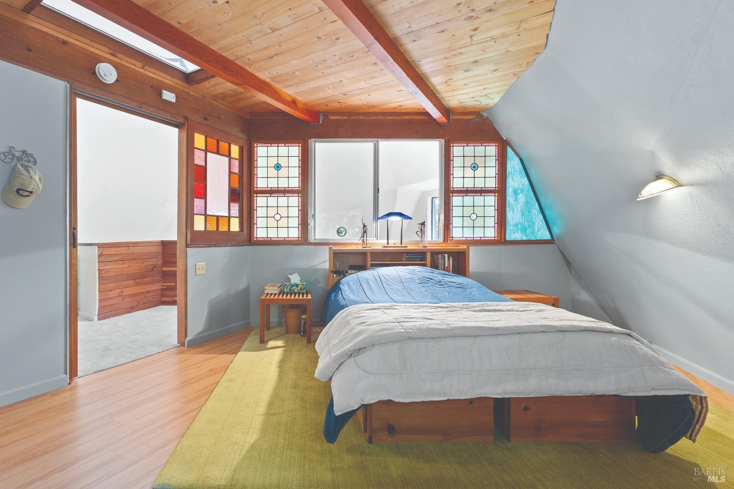 9085 Middle Terrace Monte Rio, CA 95462 - Photo 12 of 52 a bed sitting in a spacious bedroom next to a window