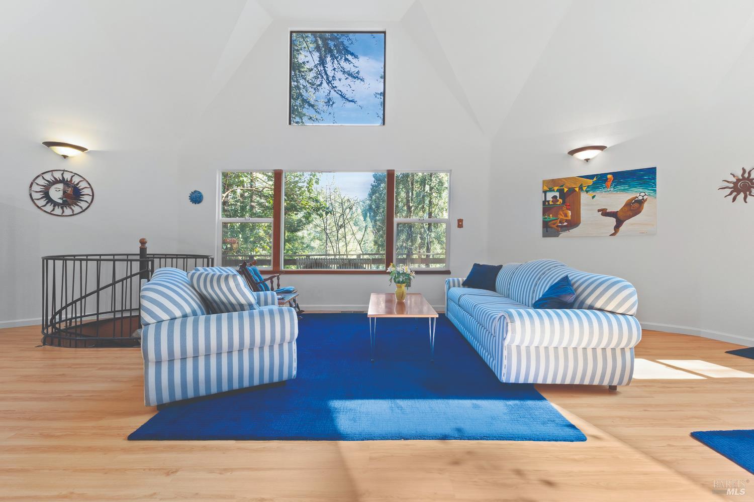9085 Middle Terrace Monte Rio, CA 95462 - Photo 16 of 77 a living room with furniture and a large window