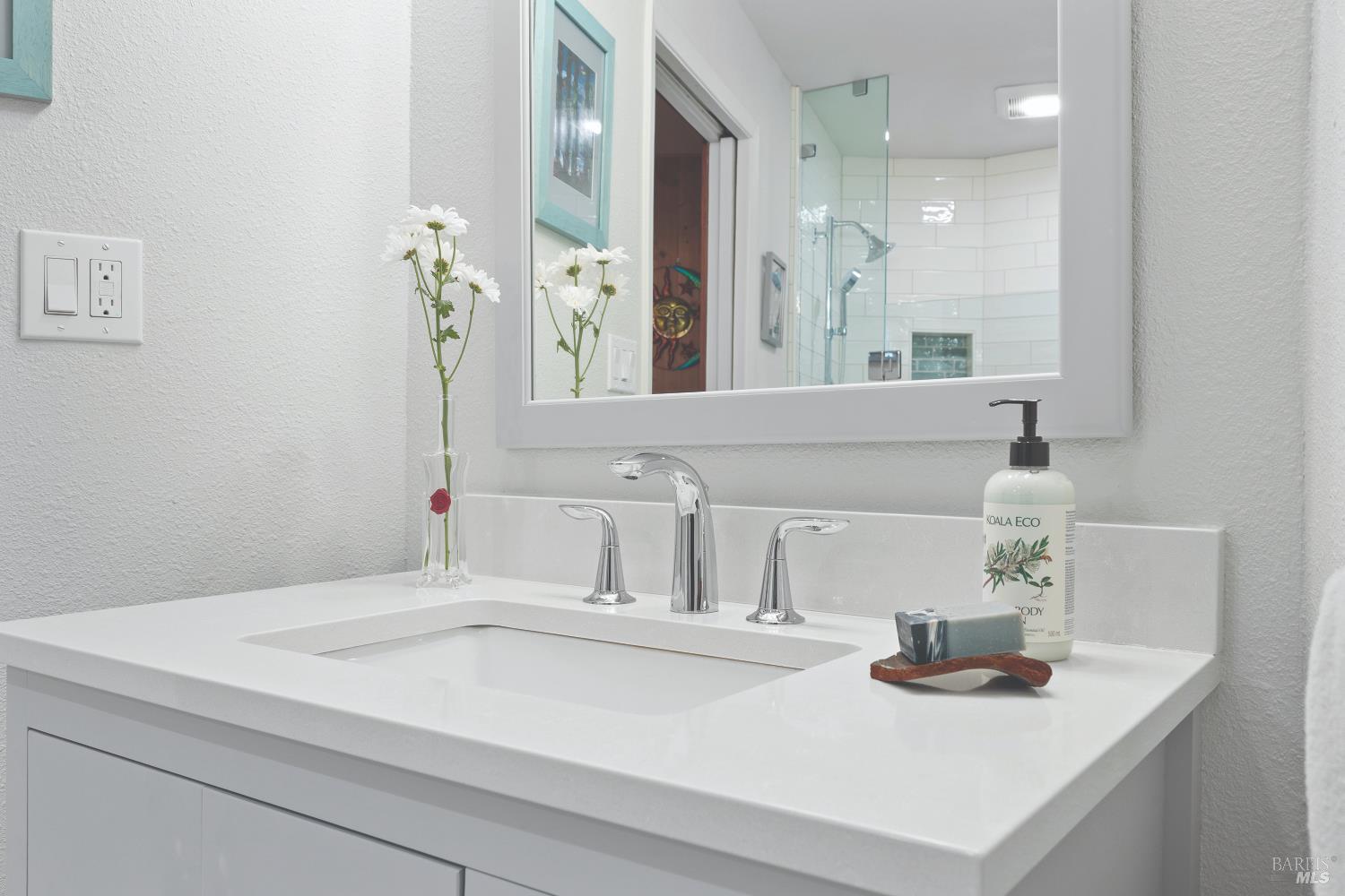 9085 Middle Terrace Monte Rio, CA 95462 - Photo 17 of 52 a bathroom with a sink and a mirror
