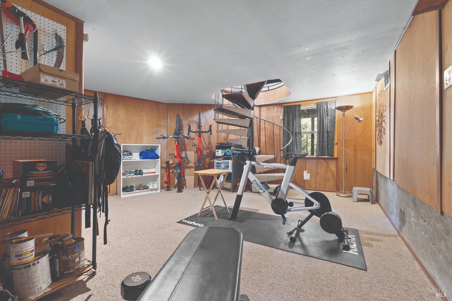 9085 Middle Terrace Monte Rio, CA 95462 - Photo 27 of 52 a room with gym equipment and a view of living room
