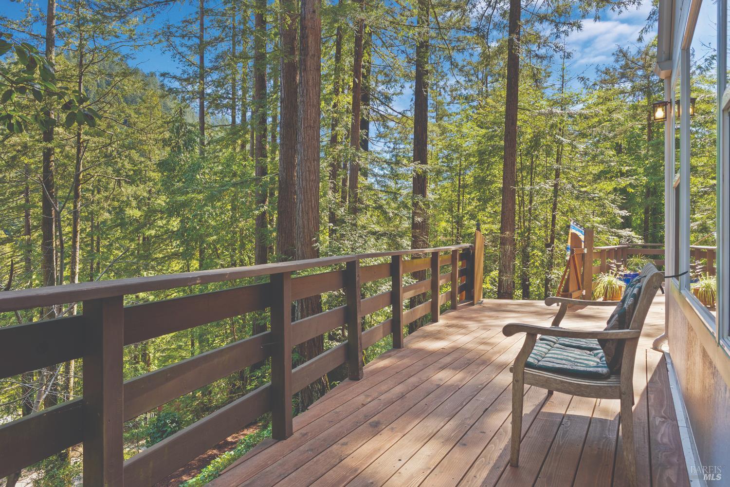 9085 Middle Terrace Monte Rio, CA 95462 - Photo 32 of 52 a view of a chairs and table on the wooden deck