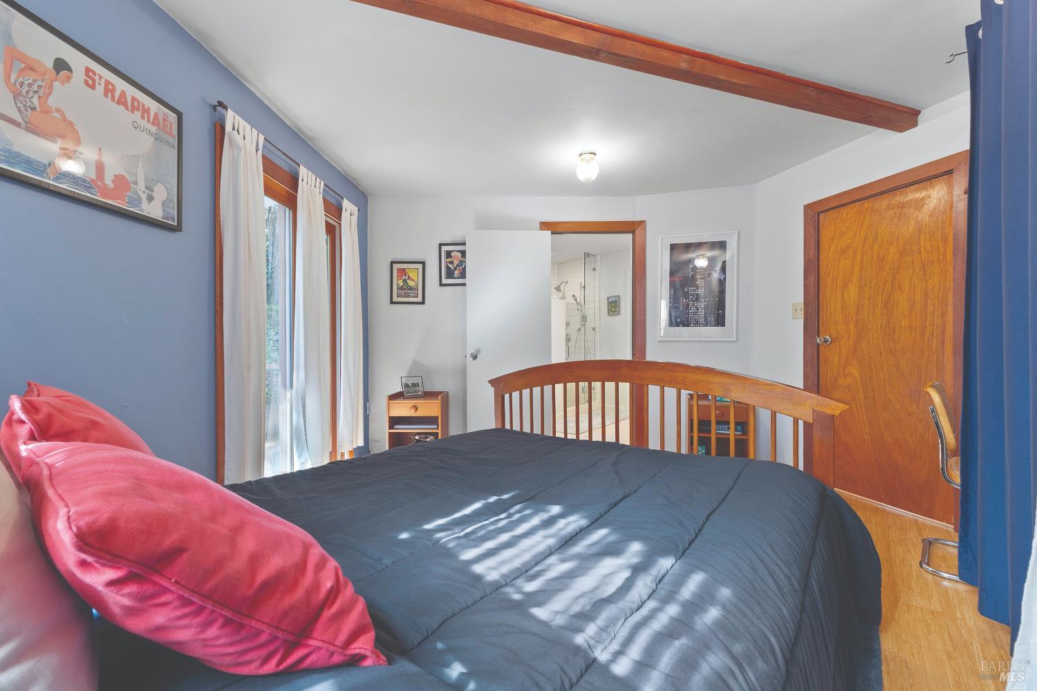 9085 Middle Terrace Monte Rio, CA 95462 - Photo 34 of 77 a view of a bedroom with a bed and wooden floor