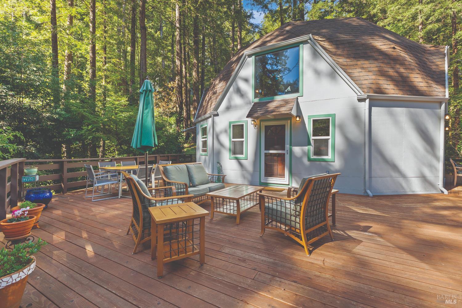 9085 Middle Terrace Monte Rio, CA 95462 - Photo 57 of 77 a backyard of a house with table and chairs