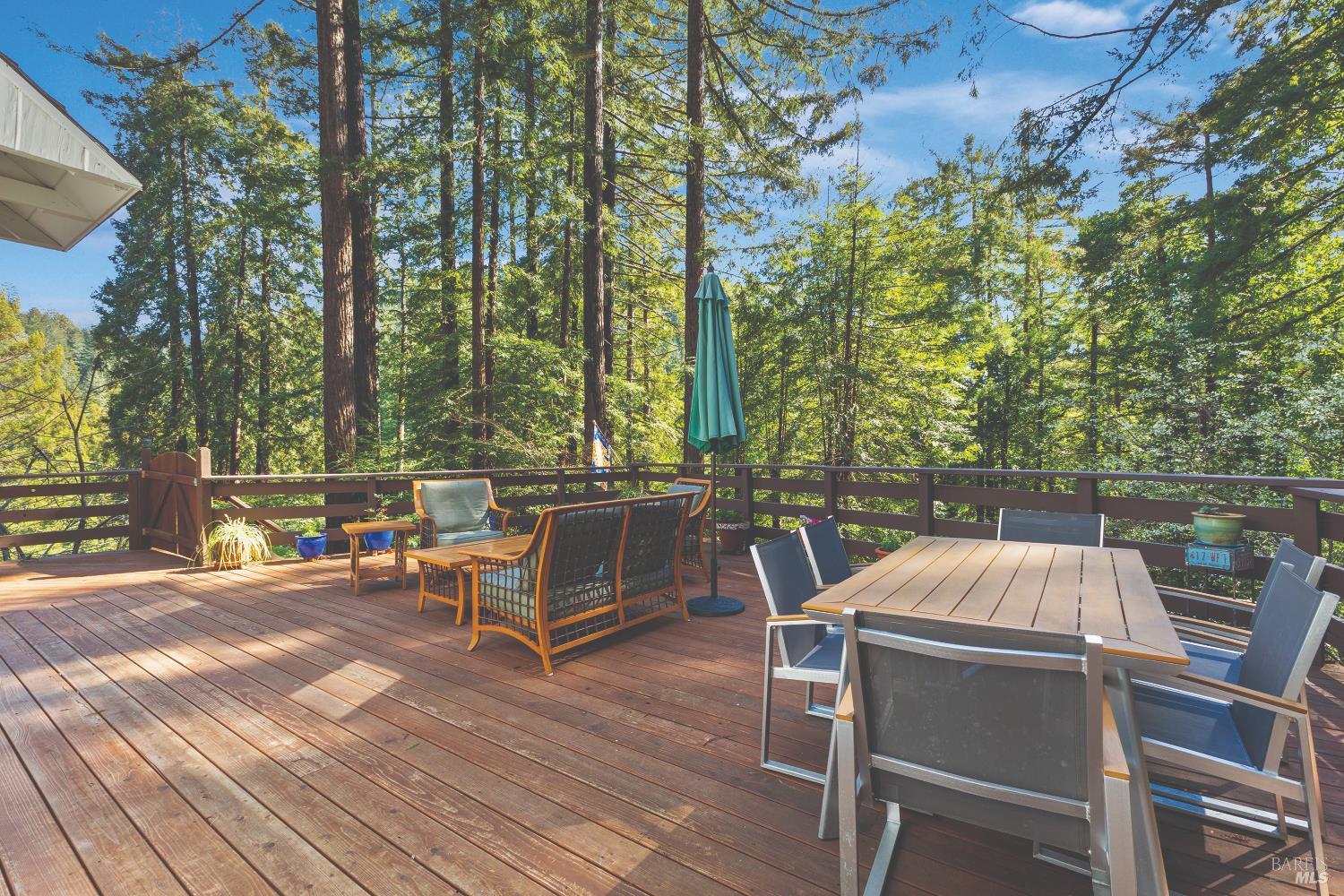 9085 Middle Terrace Monte Rio, CA 95462 - Photo 70 of 77 a view of a chairs and table on the wooden deck