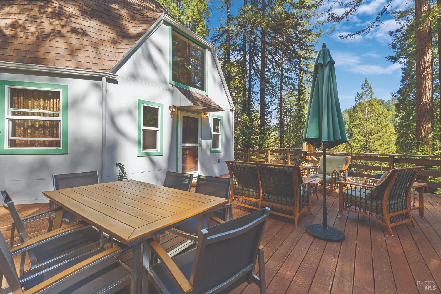 9085 Middle Terrace Monte Rio, CA 95462 - Photo 71 of 77 a view of a patio with table and chairs and wooden floor