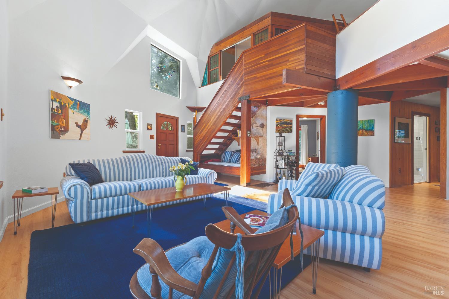 9085 Middle Terrace Monte Rio, CA 95462 - Photo 9 of 77 a living room with furniture staircase and a large window