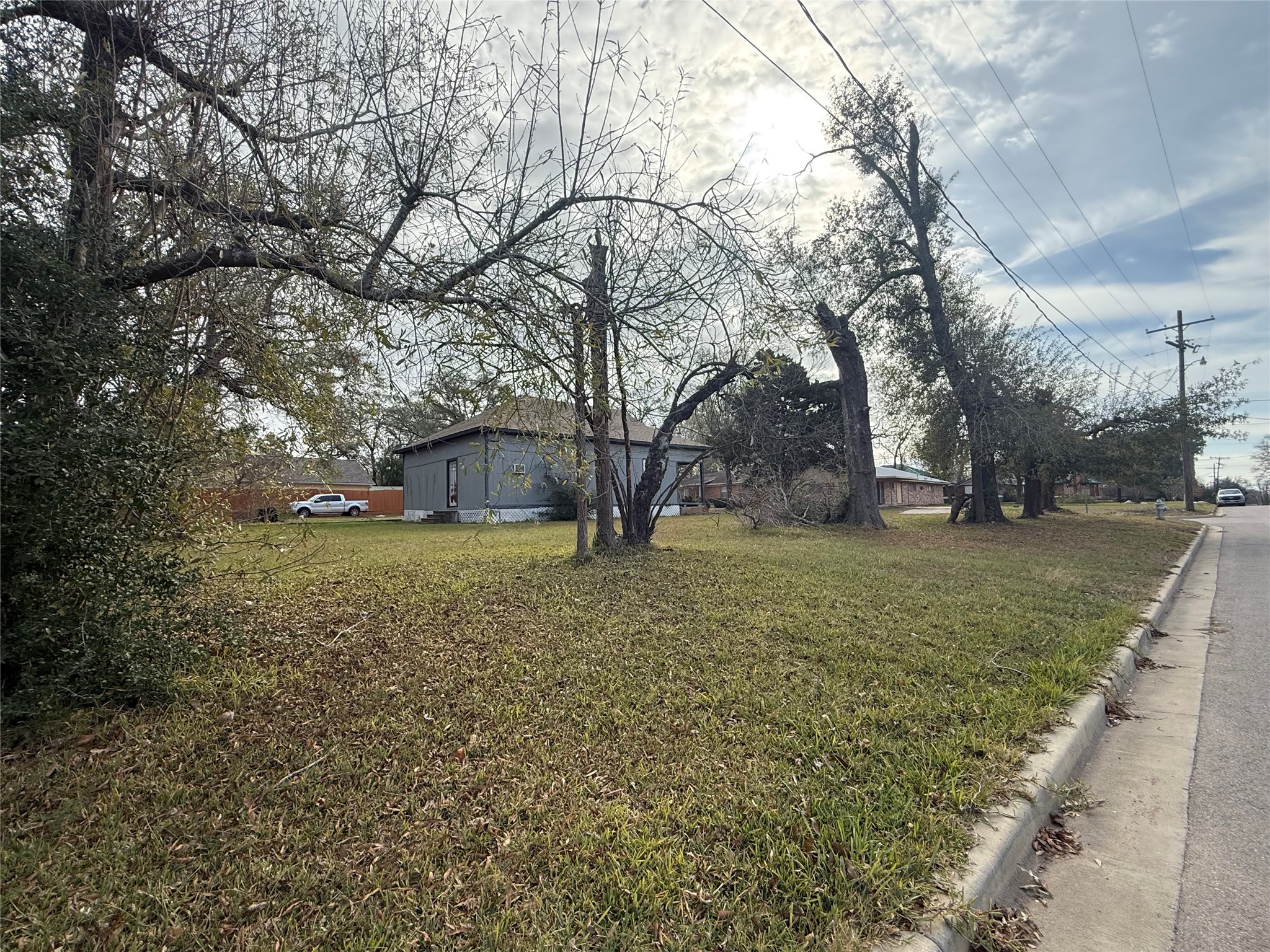 412 Waco Street Conroe, TX 77301 - Photo 28 of 50 a view of a house with a yard