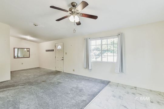 408 North Helena Street Ridgecrest, CA 93555 - Photo 9 of 22 an empty room with fan and windows