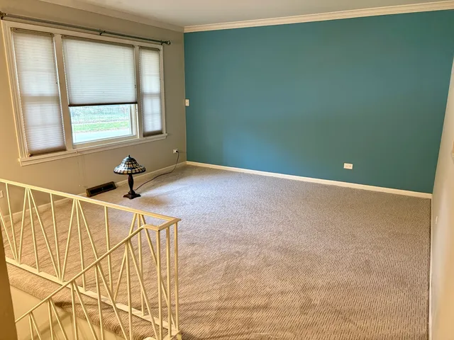 a view of a room with windows