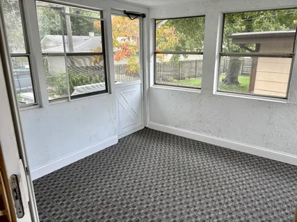 a view of empty room with windows