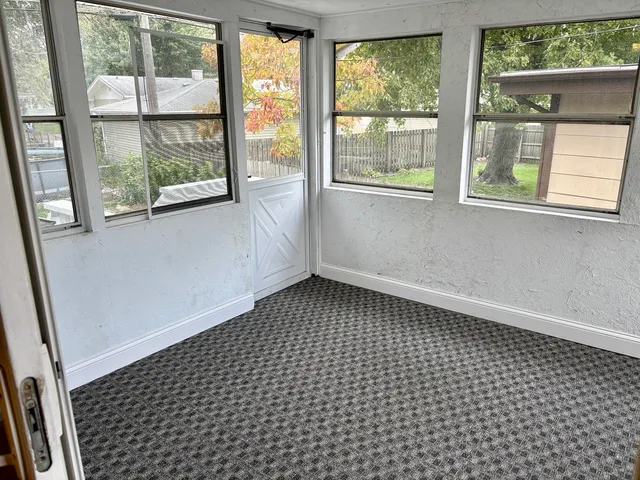 a view of empty room with windows