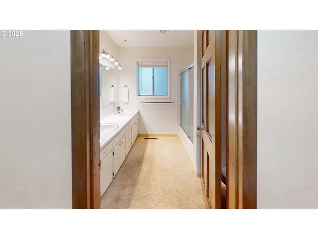 a living room with a bed furniture and a window