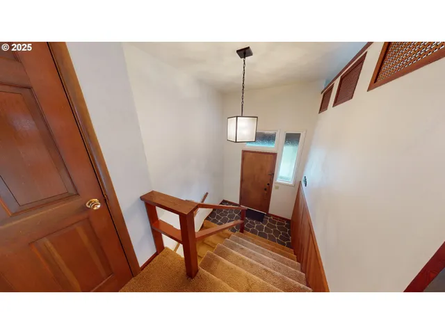 a open kitchen with sink and refrigerator