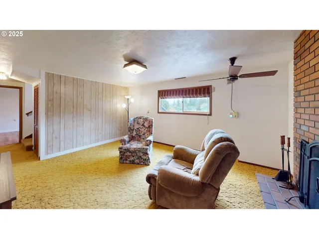 a room with a bed and a painting