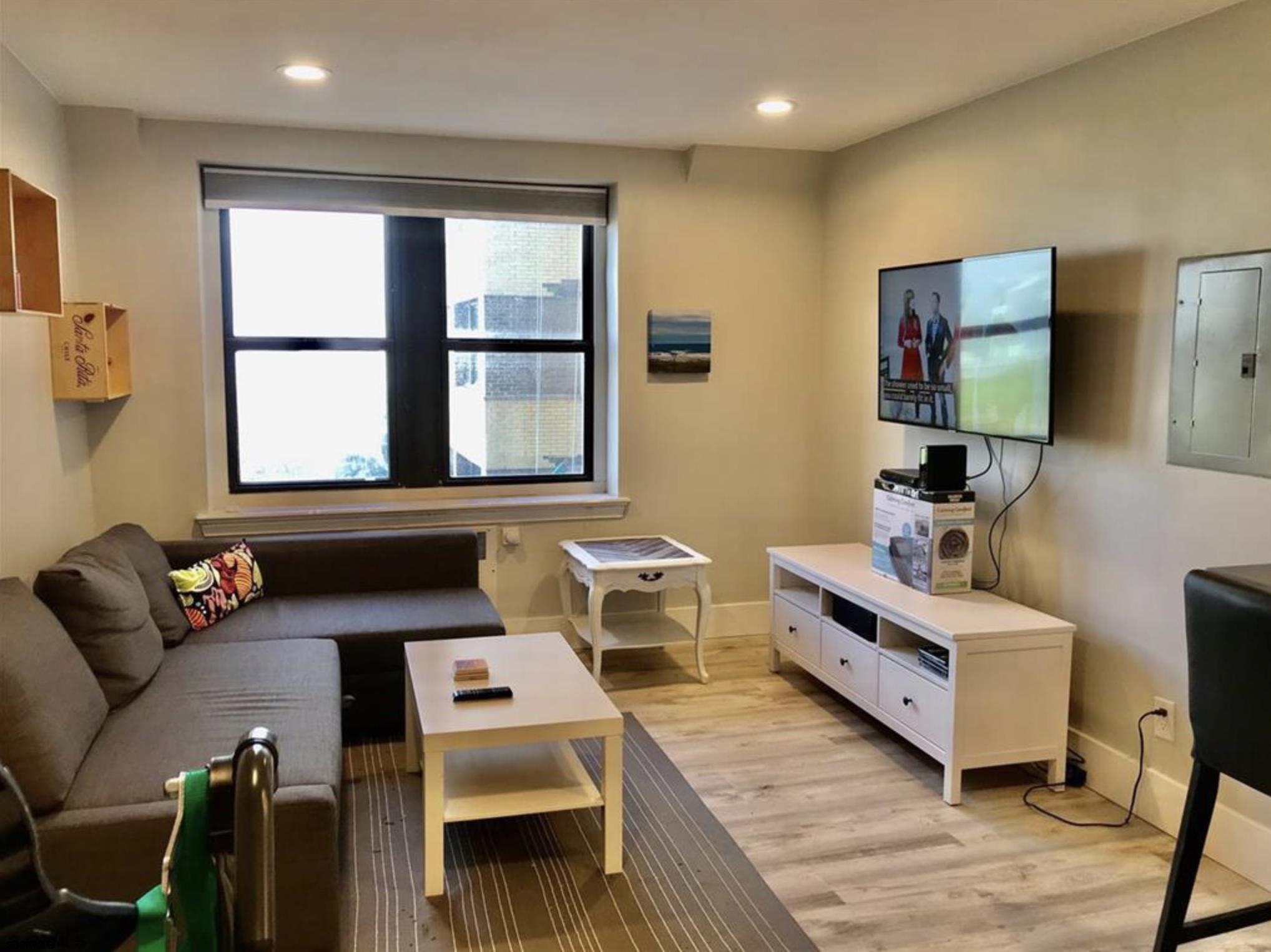 101 South Raleigh Avenue, Unit 325 Atlantic City, NJ 08401 - Photo 4 of 8 a living room with furniture and a window