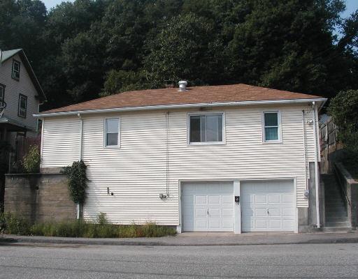 68 New Street Seymour, CT 06483 - Photo 1 of 1 a front view of a house with garage