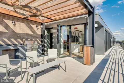 a dining room with furniture window and wooden floor
