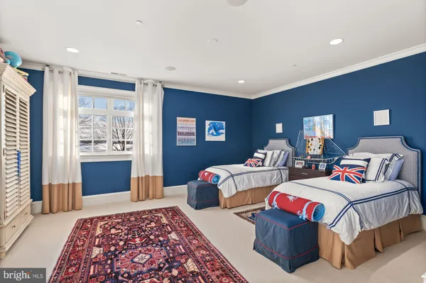 a living room with lots of furniture and a large window