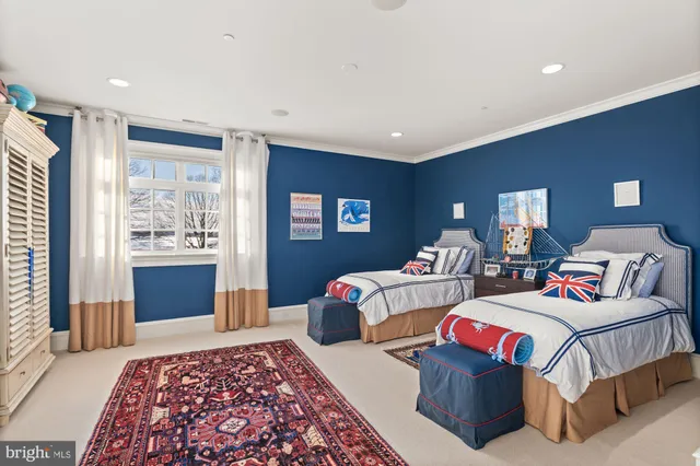 a living room with lots of furniture and a large window